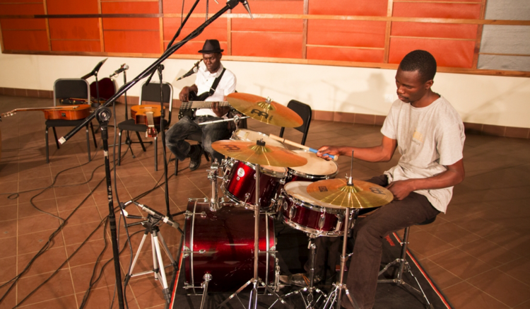 Student playing drums at Global Music Campus